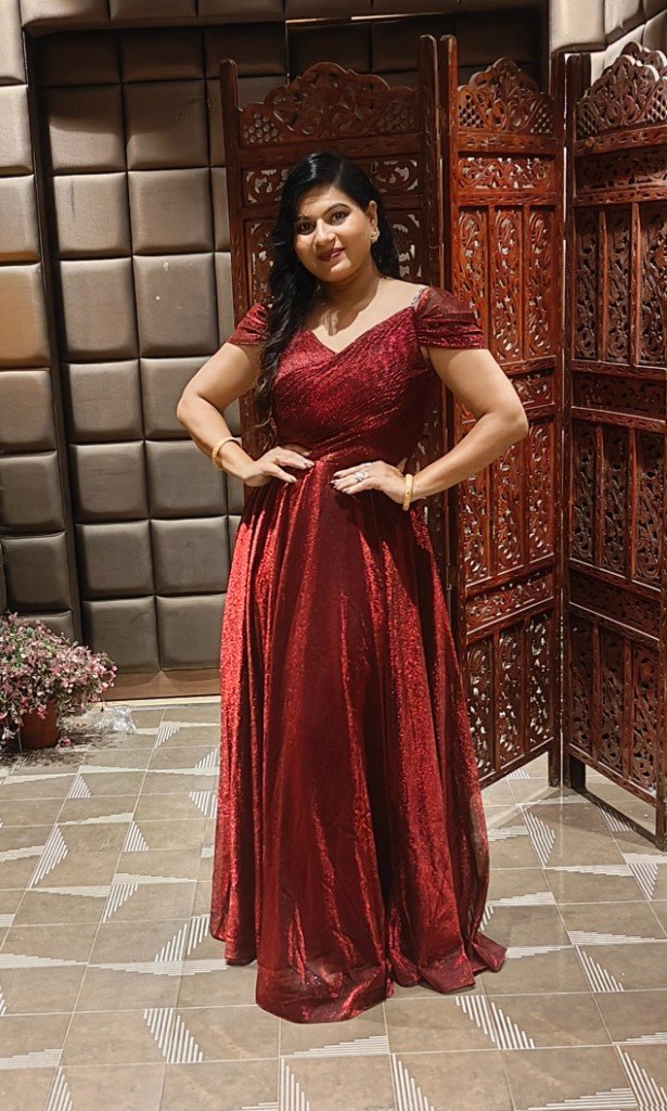 Sunita Pujapanda, co-founder of Nurturing Nest, in a red evening gown